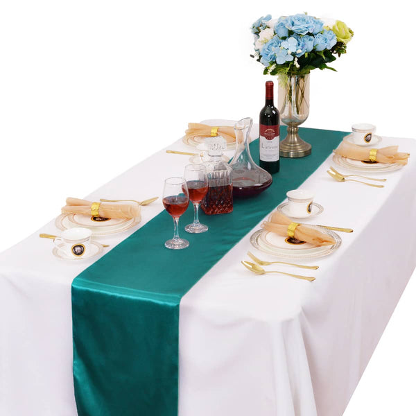 LOVWY 12 x 108-inch malachite green satin table runner with a white tablecloth