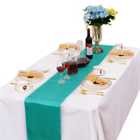 LOVWY 12 x 108-inch turquoise satin table runner with a white tablecloth